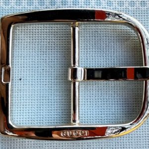 fibbia dorata gucci